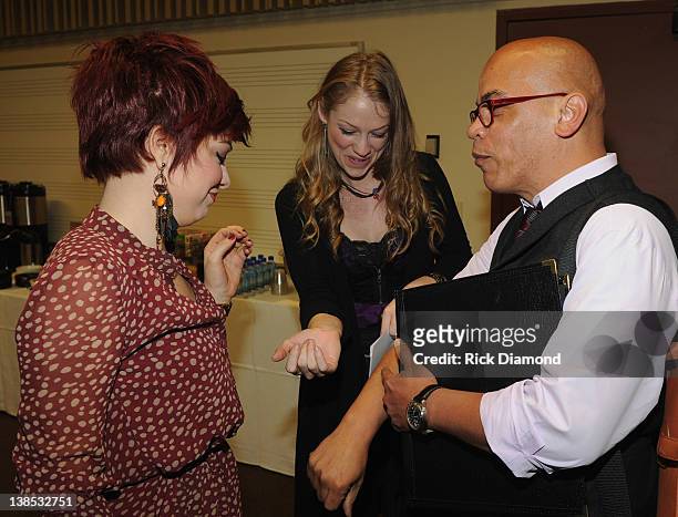 Singer/Songwriter Lacey Brown, Singer/Songwriter Didi Benami and Music Director Rickey Minor chat in the green room before The 54th Annual GRAMMY...