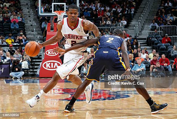 Joe Johnson of the Atlanta Hawks drives past against Darren Collison of the Indiana Pacers at Philips Arena on February 8, 2012 in Atlanta, Georgia....