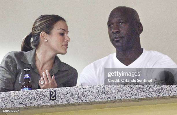 Michael Jordan, with fiancee Yvette Prieto showing the engagement bling, watches from a luxury box as Marshall visits Central Florida at the UCF...