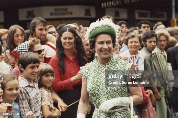 Queen Elizabeth II meets the crowds during her royal tour of New Zealand, 1977.
