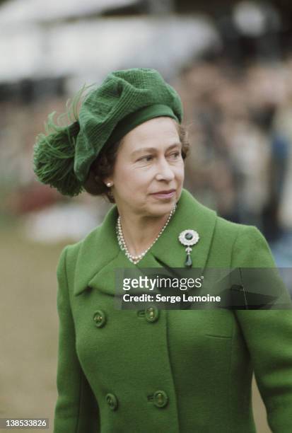 Queen Elizabeth II wearing a green tam o'shanter, circa 1980.