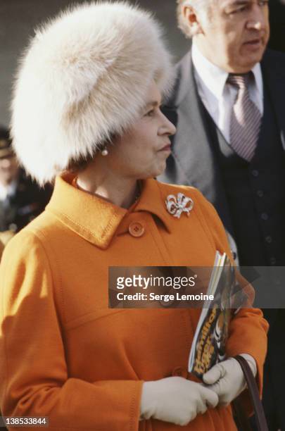 Queen Elizabeth II holding a Hamilton Tiger-Cats magazine, probably during her tour of Canada, circa 1983.