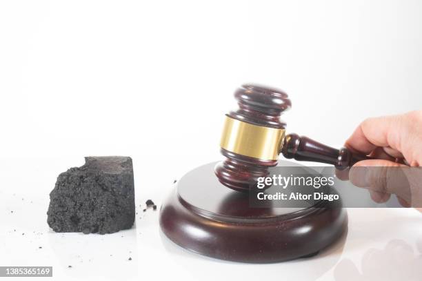 fossil energy concept and law. white background. - judges table stock pictures, royalty-free photos & images