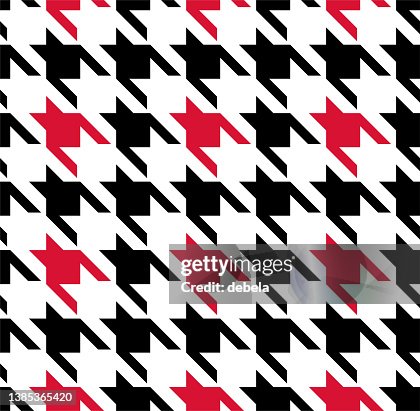 Red and black houndstooth check pattern close-up. Red and black houndstooth check pattern close-up.