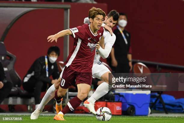 Yuya Osako of Vissel Kobe and Brendan Hamill of Melbourne Victory compete for the ball during the AFC Champions League qualifying playoff match...
