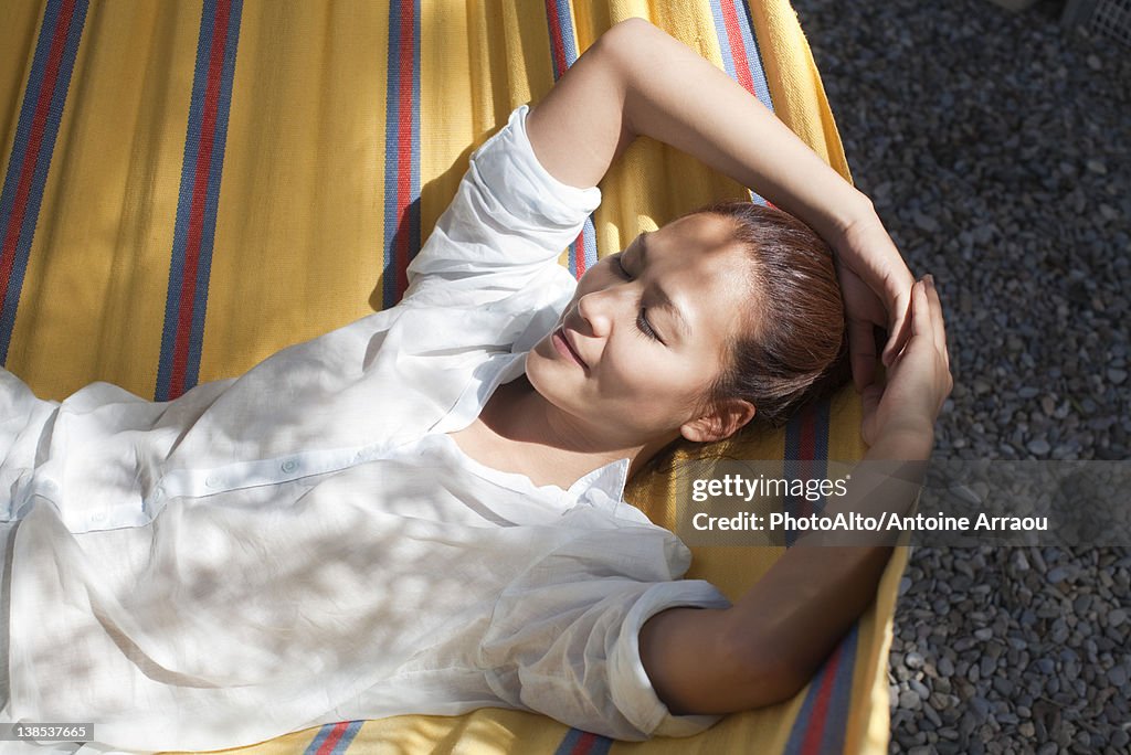 Woman napping in hammock