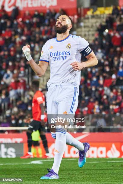 Karim Benzema of Real Madrid CF celebrates scoring his team's third goal during the LaLiga Santander match between RCD Mallorca and Real Madrid CF at...