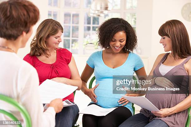 pregnant women at ante natal class - prenatal class stock pictures, royalty-free photos & images