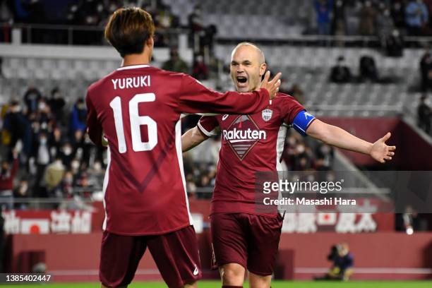 Koya Yuruki and Andres Iniesta of Vissel Kobe celebrate their fourth goal scored by Lincoln during the AFC Champions League qualifying playoff match...