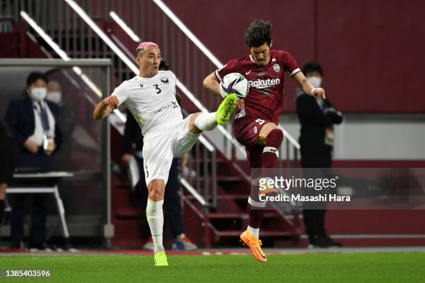 Jason Davidson of Melbourne Victory and Hotaru Yamaguchi of Vissel Kobe compete for the ball during the AFC Champions League qualifying playoff match...
