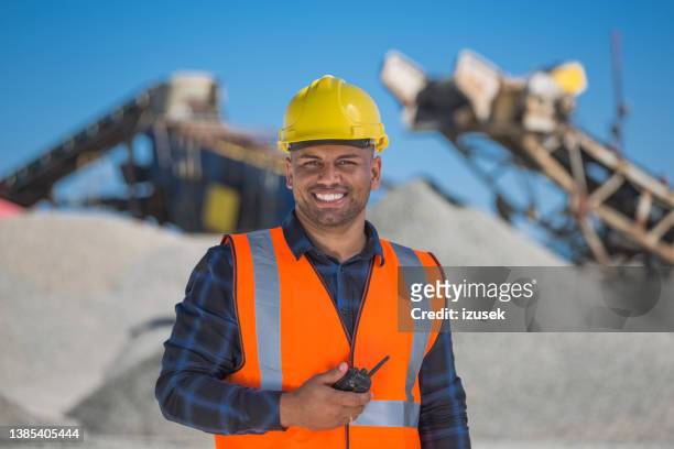 portrait of open-pit mine worker - granite mining quarry stock pictures, royalty-free photos & images