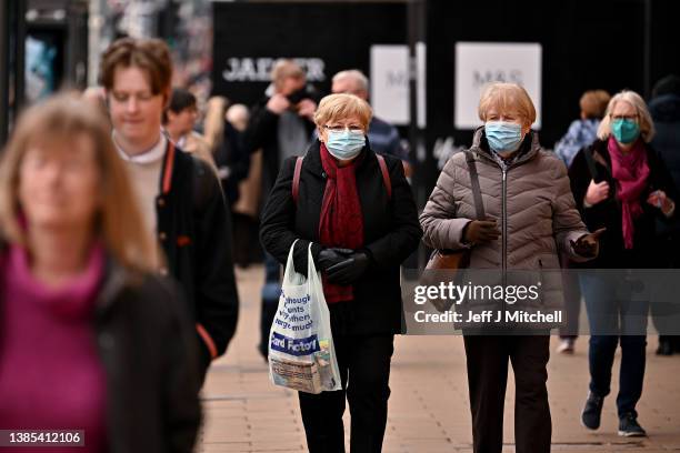 Members of the public walk along Princess Street ahead of First Ministers Nicola Sturgeon Coronavirus update to the Scottish Parliament on March 15,...