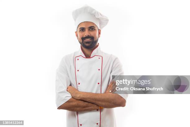 smiling male chef in uniform - kochmütze stock-fotos und bilder