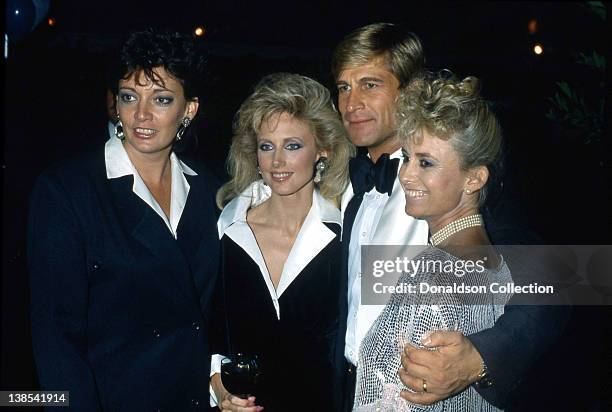 Sarah Douglas, Morgan Fairchild, Simon MacCorkindale, Susan George pose for a portrait at an event in 1985 in Los Angeles, California.