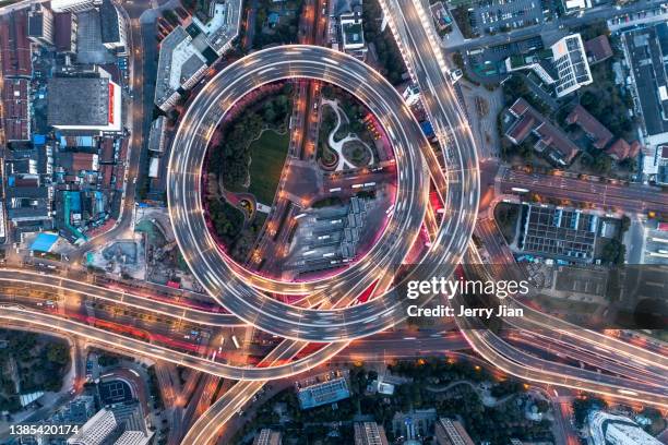 busy intersection in the night of shanghai city - shanghai bridge stock pictures, royalty-free photos & images