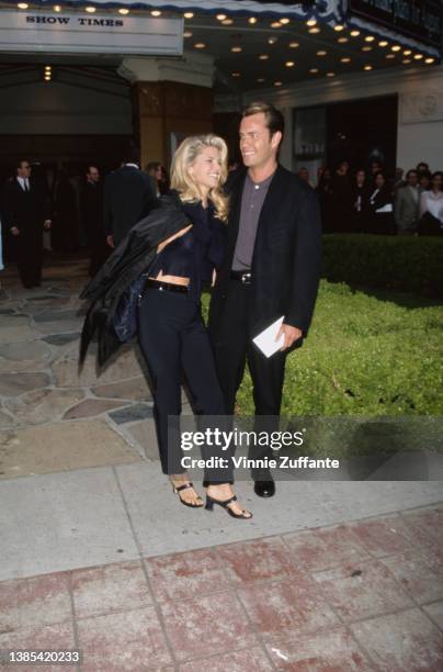 American fashion model Christie Brinkley and American architect Peter Cook attend the Westwood premiere of 'Independence Day,' held at Mann Village...