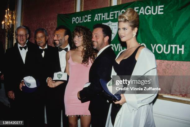 American politician and lawyer David Dinkins , Mayor of New York City, American music executive Tommy Mottola, American singer Mariah Carey, American...