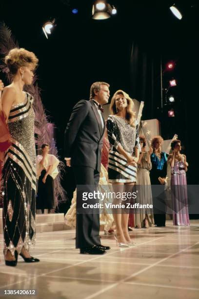 Norwegian model Anette Stai, American actor Lee Majors, and American model Christie Brinkley on stage at the recording of 'The Face of the 80s'...