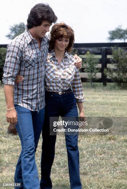 Actor Patrick Duffy and actress Victoria Principa in a quiet moment on the set of the TV show 'Dallas in circa 1982.