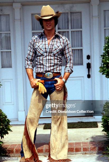 Actor Patrick Duffy poses for a portrait wearing a cowboy hat and chaps for a portrait session in circa 1980 in Los Angeles, California.