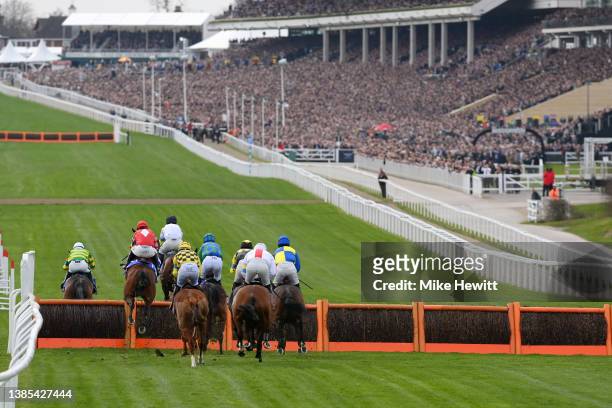 General view as runners and riders compete in Sky Bet Supreme Novices' fence during day one of the Cheltenham Festival 2022 at Cheltenham Racecourse...