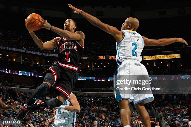 Derrick Rose of the Chicago Bulls shoots the ball over Jarrett Jack of the New Orleans Hornets at New Orleans Arena on February 8, 2012 in New...