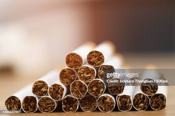image of several commercially,close-up of spices in spoons on table - heated tobacco product imagens e fotografias de stock