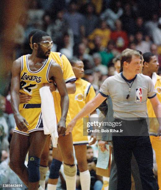 James Worthy is led away by a teammate during dispute with Celtics players during 1985 NBA Finals between Los Angeles Lakers and Boston Celtics, June...