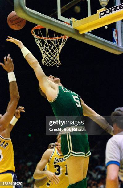 Bill Walton stretches to get rebound during 1985 NBA Finals between Los Angeles Lakers and Boston Celtics, June 2, 1985 in Inglewood, California.