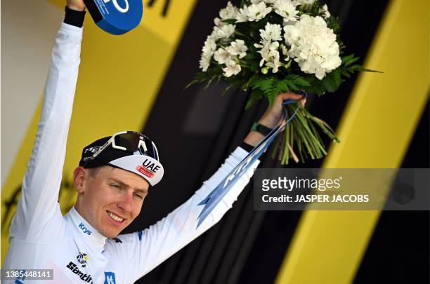 British Adam Yates of UAE Team Emirates celebrates as leader in the overall ranking after the second stage of the Tour de France cycling race, a...