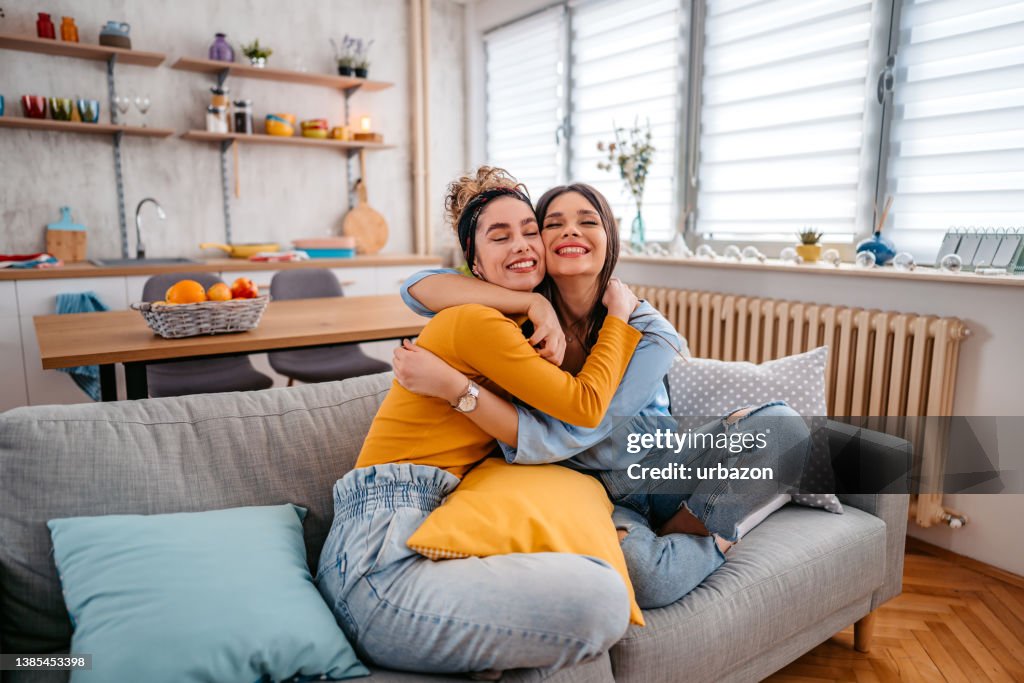 Two Female Friends Embracing Each Other