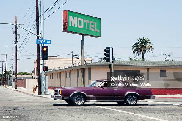 car passing motel in los angeles, california - モーテル ストックフォトと画像