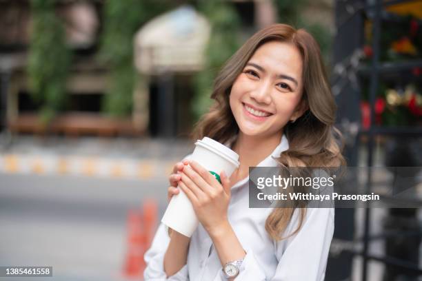 portrait of a young adult asian woman - coffee cup mockup stock pictures, royalty-free photos & images