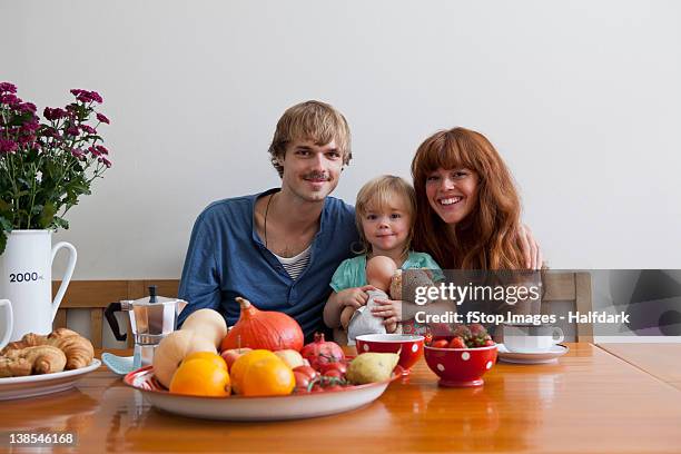 a young family having breakfast - breakfast close stock pictures, royalty-free photos & images
