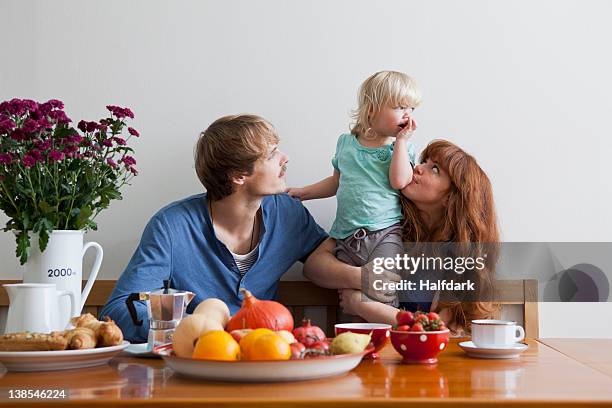 a young family having breakfast - breakfast close stock pictures, royalty-free photos & images