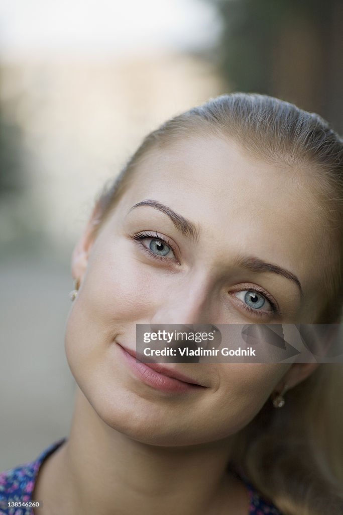 A young woman with beautiful blue eyes, close-up