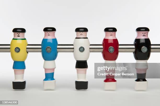 five foosball figurines wearing different uniforms - table football stock pictures, royalty-free photos & images