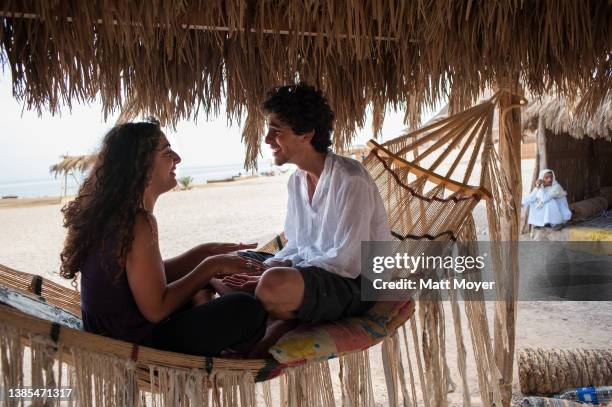 Shimrit Oded of Israel spends some time with Egyptian, Youssef Bashat of Cairo while vacationing at camp Ras Shitan during the Passover holiday on...