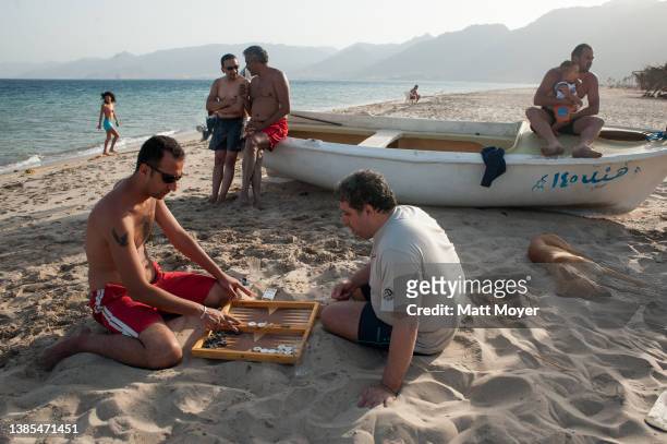 Tourists enjoy the beach while vacationing at camp Bawaki near the city of Nuweiba in the Sinai, Egypt on April 27, 2008.