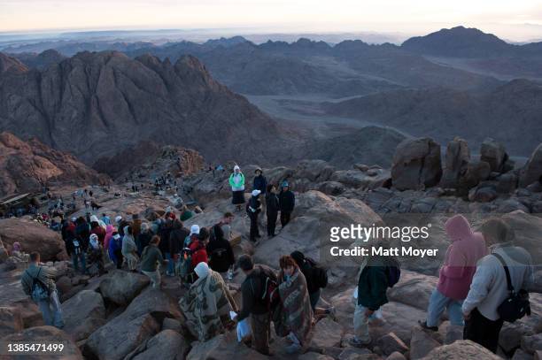 Flock of tourists walk down the path on Mount Moses after watching the sunrise in the Sinai, Egypt on May 10, 2008.