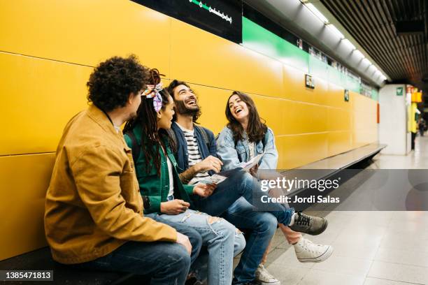 group of friends in a metro station - underground rail stock pictures, royalty-free photos & images