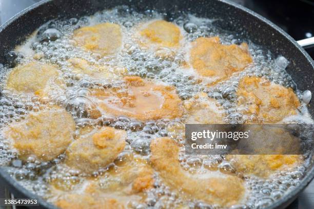 pleurotus ostreatus mushroom breaded with egg, being fried with sunflower seed - breaded stock pictures, royalty-free photos & images