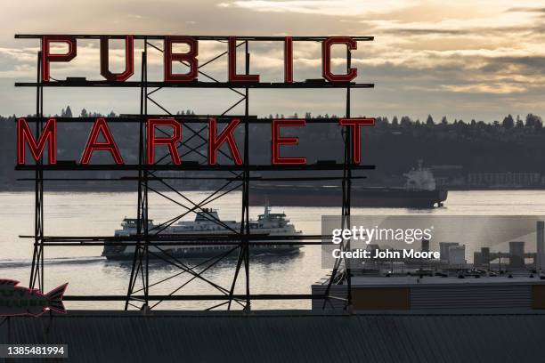 Ferry and a tanker pass through the Puget Sound near Seattle's iconic Pike Place Market on March 11, 2022 in Seattle, Washington. The market remains...