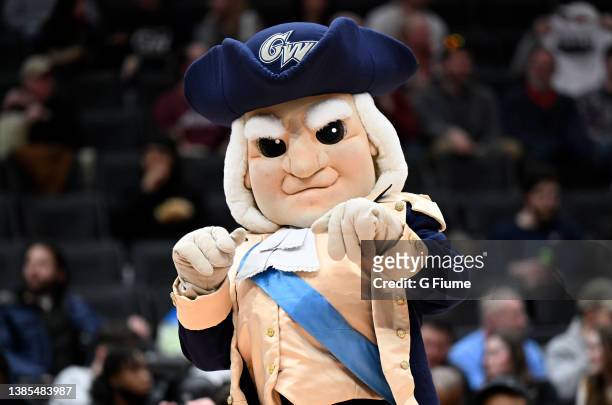 The George Washington Colonials mascot performs in the second half against the Massachusetts Minutemen during the Second Round of the 2022 Atlantic...