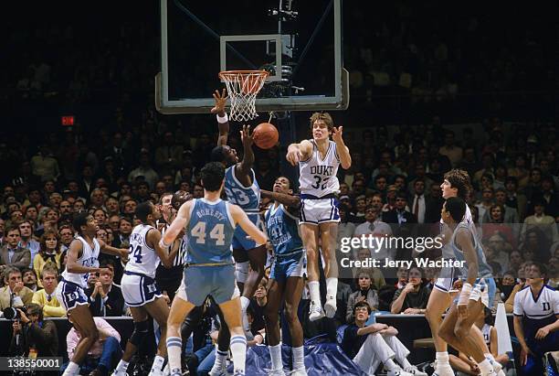 Tournament: Duke Mark Alarie in action, pass vs North Carolina Michael Jordan and Sam Perkins during Semifinals at Greensboro Coliseum. Greensboro,...