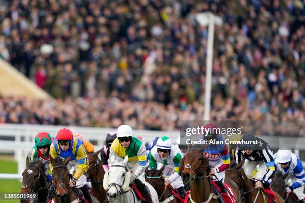 General view as runners turn away from the grandstand during The Ultima Handicap Chase on day one of The Festival at Cheltenham Racecourse on March...