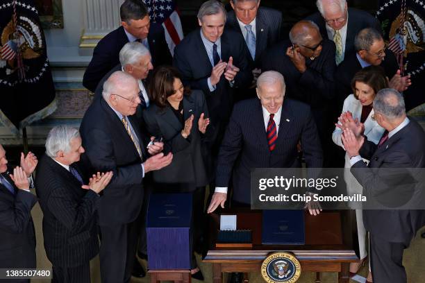 President Joe Biden is applauded by Vice President Kamala Harris and Congressional leaders after signing the “Consolidated Appropriations Act" in the...