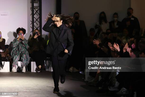 Designer William Fan acknowledges the applause of the audience at the William Fan Fashion Show during the Berlin Fashion Week March 2022 at Hamburger...