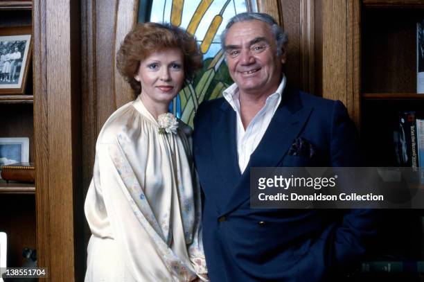 Actor Ernest Borgnine poses for a portrait with his wife Tova Traesnaes Borgnine at their home in circa 1980 in Los Angeles, California.