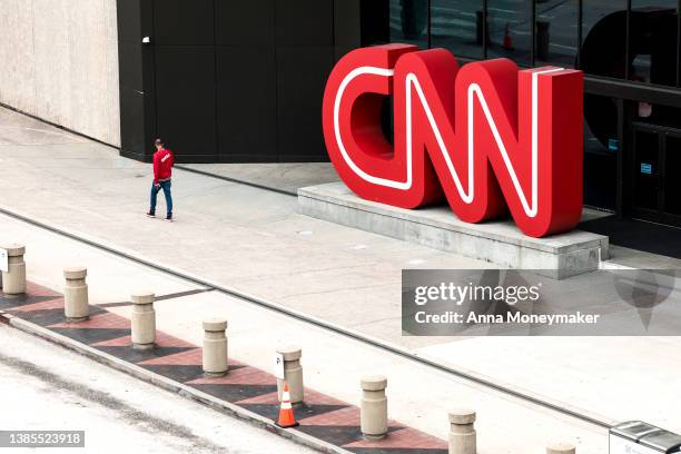 People walk by the world headquarters for CNN on March 15, 2022 in Atlanta, Georgia. Last month CNN's president Jeff Zucker resigned over a...